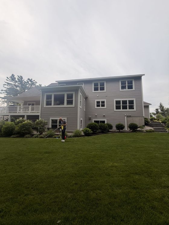 Window cleaning project on the rear of a large West Michigan home